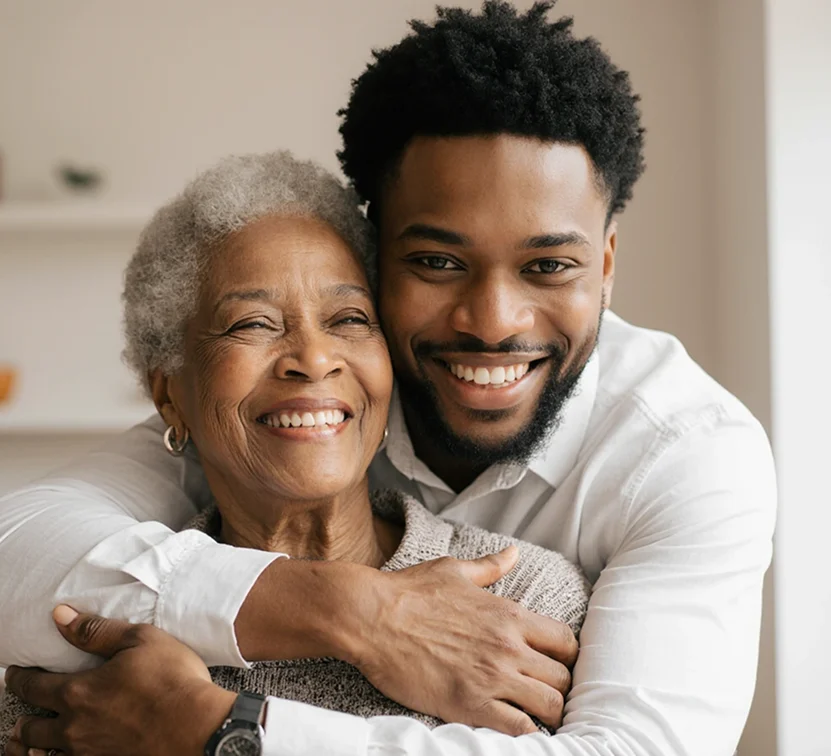 Young man hugging his elderly mother